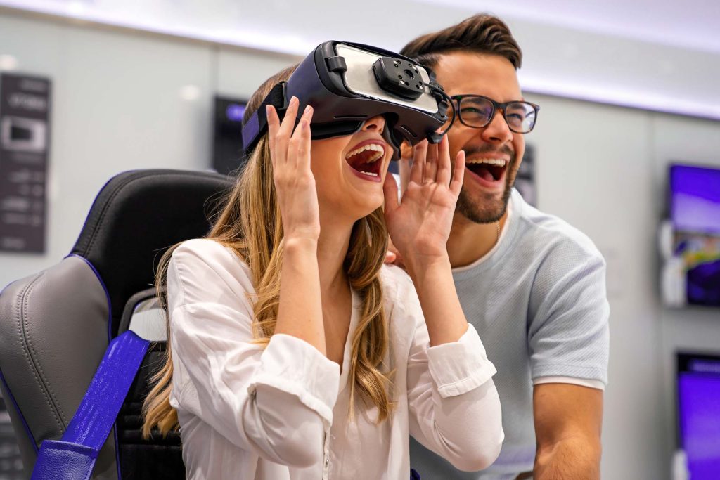 Group of young people using virtual reality headset at exhibition, show. VR technology simulation concept